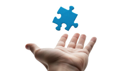 A hand reaches up to catch a floating blue jigsaw puzzle piece against a white background.