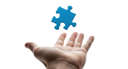 A hand reaches up to catch a floating blue jigsaw puzzle piece against a white background.