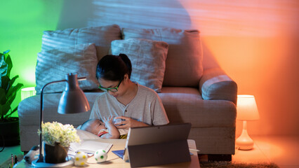 Women working from home at night