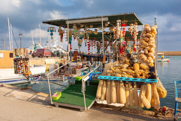Floating souvenir shop selling sponges and handmade crafts at the harbor of Chania in Crete, Greece