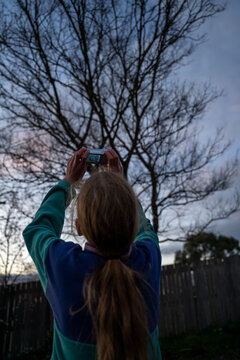 Young child silohette photo sunset from behind