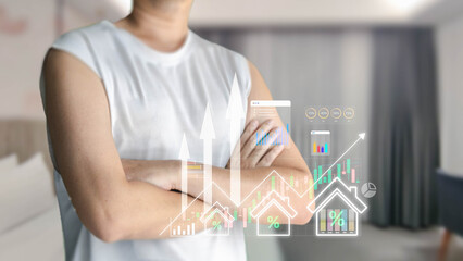 A person stands with arms crossed, observing a holographic display of a rising real estate market...