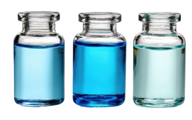 Three clear glass vials, filled with light blue,  medium blue, and light teal liquid