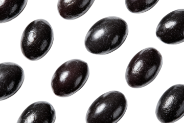 Dark, glossy, oval-shaped candies arranged in a repeating pattern against a black background.  Each candy has a smooth, dark surface