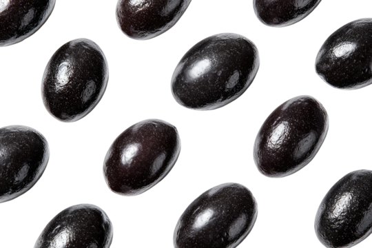 Dark, glossy, oval-shaped candies arranged in a repeating pattern against a black background.  Each candy has a smooth, dark surface
