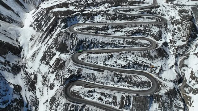 Los Caracoles highway road near Santiago Chile in aerial view. Snow highway road.