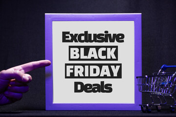 Hand pointing to an illuminated frame with the sign “Exclusive Black Friday Deals.” Ad ready...