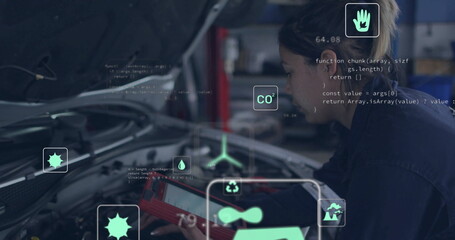 Mechanic operating scanner under car hood in coveralls in workshop, displaying overlays, copy space