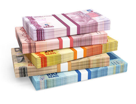 Stacks of Brazilian real banknotes in different denominations