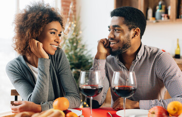 Romantic date. Millennial black couple in love looking at each other with affection and tender, kitchen interior