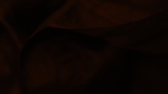 Faint shadow folds on ultra dark textured canvas, abstract low light backdrop with subtle depth and minimal visual clarity