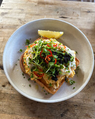 A plate of toast with scrambled eggs.