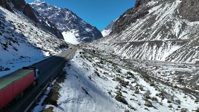Los Caracoles highway road near Santiago Chile in aerial view. Road at Andes Mountains. Snowing scenery. Snow highway road. Winding curves near Argentina and Chile border