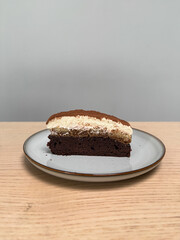A slice of brownie tiramisu cake.