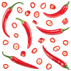 An assortment of red chili peppers, both whole and sliced.