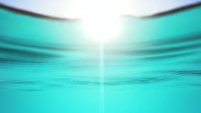 Sea water surface. Low angle view over clear azure sea water. Sun glare. Abstract nautical summer ocean nature. Holiday, vacation and travel concept. Nobody. Slow motion. Weather and climate change