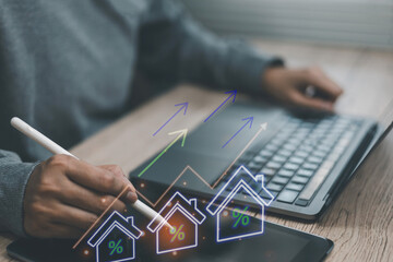 Concepts of property real estate investment person hand using pen pointing tablet housing analyzing...