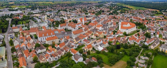 An aerial panorama view above the old town of the city Dillingen on a cloudy summer day in Bavaria, Germany