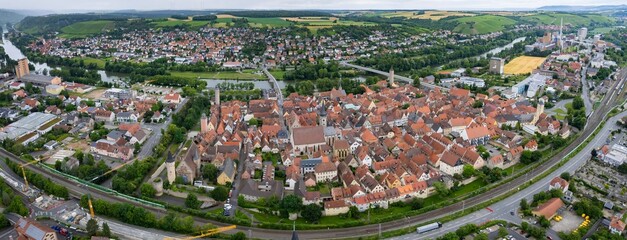 An aerial panorama view above the old town of the city Ochsenfurth on a cloudy summer day in Bavaria, Germany