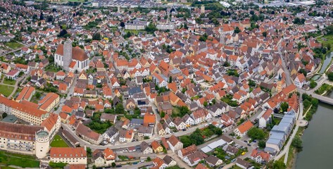 An aerial panorama view above the old town of the city Lauingen on a cloudy summer day in Bavaria,...