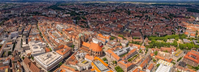 An aerial panorama view above the old town in the city Nuremberg or Nürmberg during an overcast summer day in Bavaria, Germany