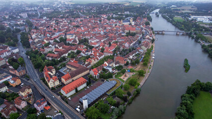  An aerial panorama view above the old town of the city Kitzingen on a cloudy summer day in Bavaria, Germany