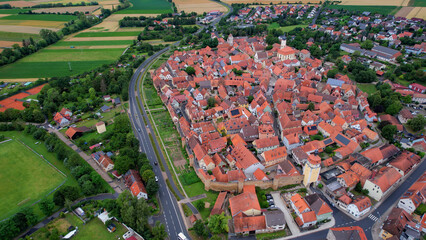 Aerial panorama view of the old town in the city Mainbernheim in Bavaria in Germany on a cloudy day in spring