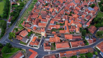 Aerial panorama view of the old town in the city Mainbernheim in Bavaria in Germany on a cloudy day in spring