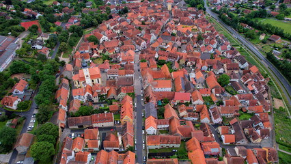 Aerial panorama view of the old town in the city Mainbernheim in Bavaria in Germany on a cloudy day in spring