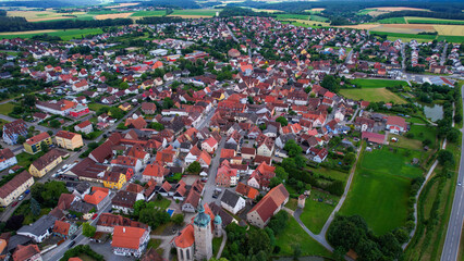  An aerial panorama view above the old town of the city Markt Erlbach on a cloudy summer day in Bavaria, Germany