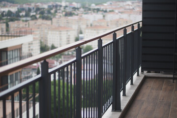 Fototapeta premium Modern balcony overlooking urban cityscape during daytime