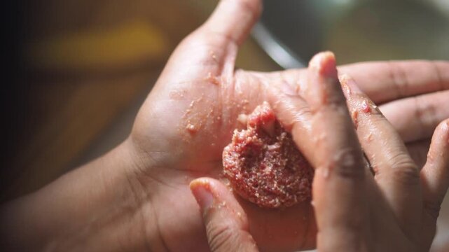 Cooking traditional meatballs in a cozy kitchen