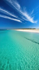 Turquoise waters meet white sandy beach with crystal clear lagoon