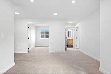 Large, empty room with a window and a door