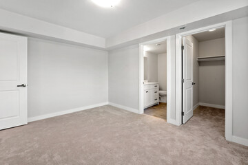 White room with a toilet and a sink