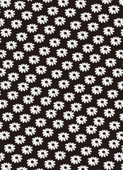 Seamless pattern of small white daisies with yellow centers against a black background, a delicate floral design