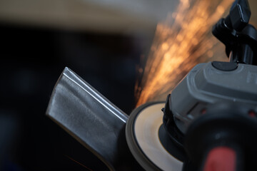 Angle Grinder Throwing Sparks While Grinding Metal