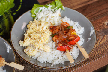 Rice Bowl Omelet, captured on September 8, 2025. Fusion dish combining fluffy omelet over steamed rice with rich Indonesian flavors, savory modern comfort food with local culinary touch