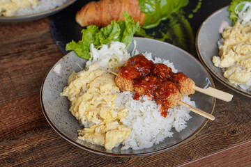 Rice Bowl Omelet, captured on September 8, 2025. Fusion dish combining fluffy omelet over steamed rice with rich Indonesian flavors, savory modern comfort food with local culinary touch