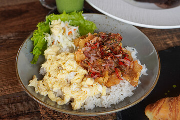 Rice Bowl Omelet, captured on September 8, 2025. Fusion dish combining fluffy omelet over steamed rice with rich Indonesian flavors, savory modern comfort food with local culinary touch