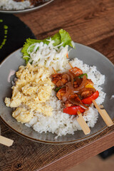 Rice Bowl Omelet, captured on September 8, 2025. Fusion dish combining fluffy omelet over steamed rice with rich Indonesian flavors, savory modern comfort food with local culinary touch
