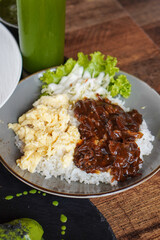 Rice Bowl Omelet, captured on September 8, 2025. Fusion dish combining fluffy omelet over steamed rice with rich Indonesian flavors, savory modern comfort food with local culinary touch