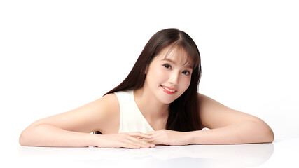 Fototapeta premium A beautiful young Asian woman with clean, fresh skin against a white background. Skincare, facial treatment, cosmetology, beauty, and spa. An elegant portrait of an Asian woman.