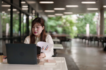 Asian woman freelance remote work outdoor office laptop business data analysis financial report planning strategy global productivity