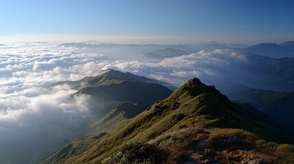 Fototapeta premium A view from a mountain summit over a sea of clouds