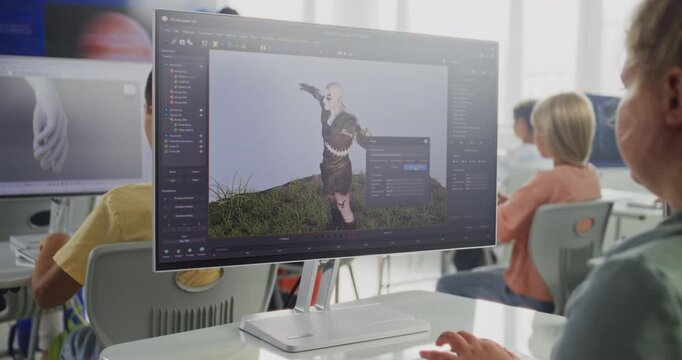 Smart Young Girl Using Computer, Creating Game Character in Design Software, Practicing 3D Modeling. Elementary School Children Learning Animation, Game Development and Digital Art. STEM Education.