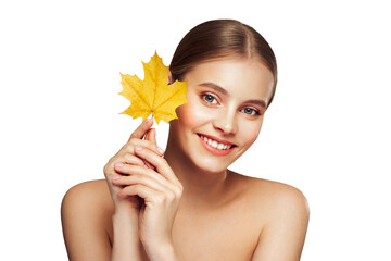 Portrait of beautiful young woman with autumn leafs. Healthy clean fresh skin natural make up...