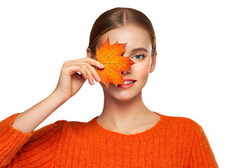 Portrait of beautiful young woman in orange blouse with autumn leafs. Healthy clean fresh skin...