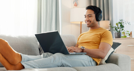 Calm, headphones and laptop with man on sofa for streaming service, film website and comfortable....
