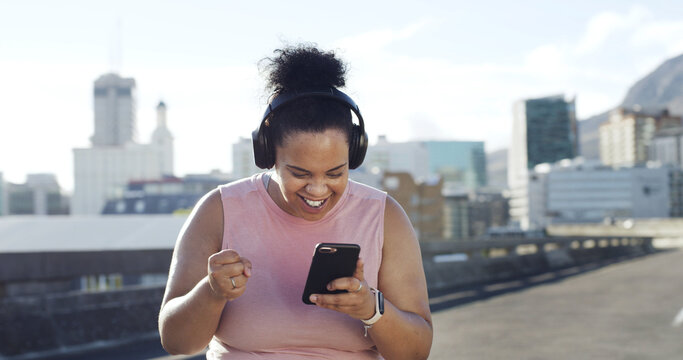 Happy woman, plus size and winning with phone for fitness challenge or workout goals in city. Excited, female person or smile with mobile smartphone for good news, weight loss achievement or progress - Powered by Adobe
